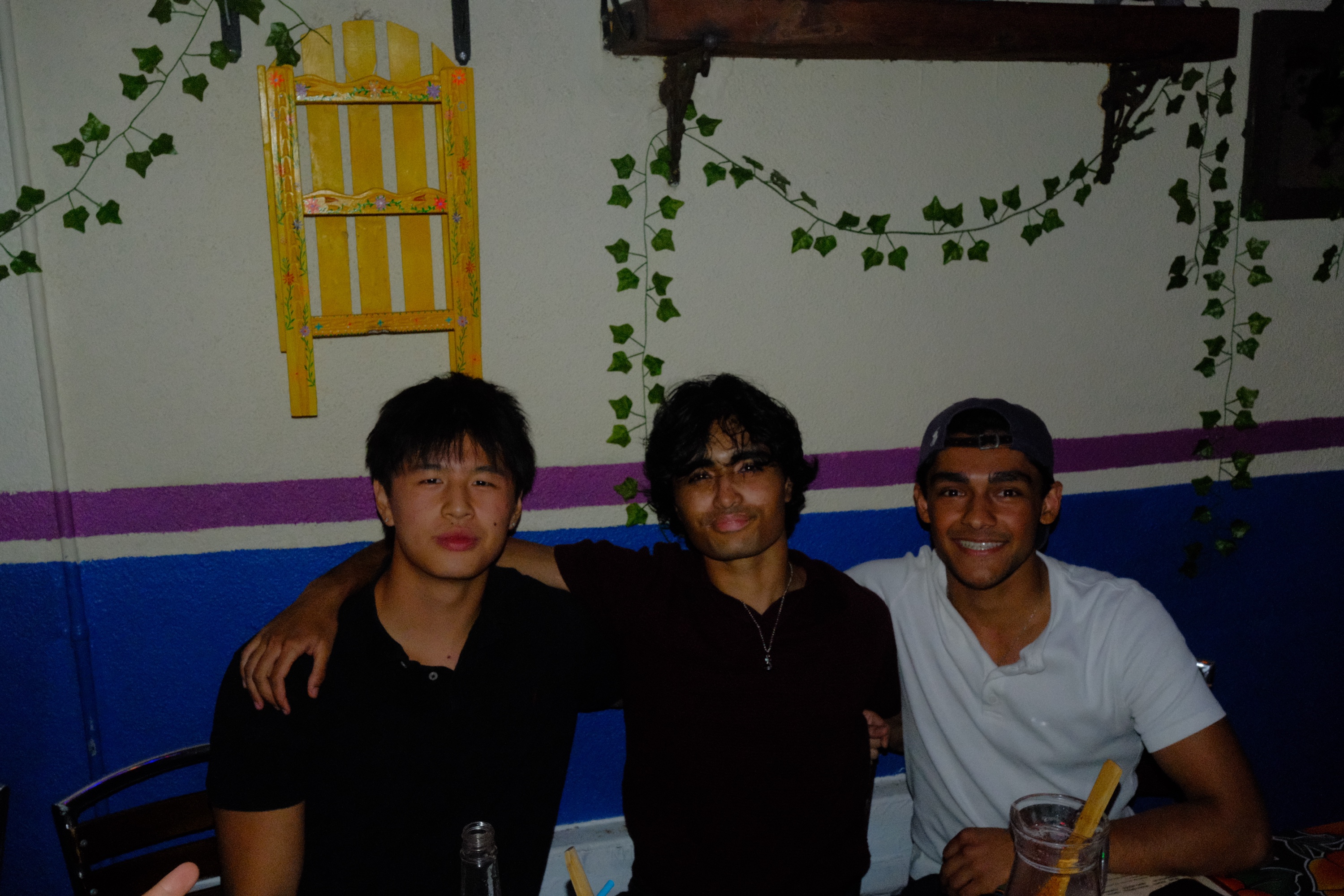 Max Shen with two friends at dinner